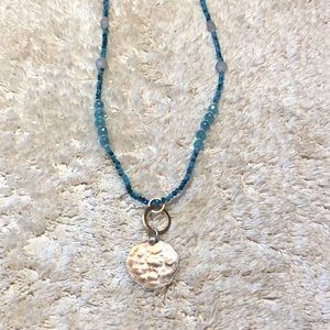 Beaded necklace with hammered silver charm